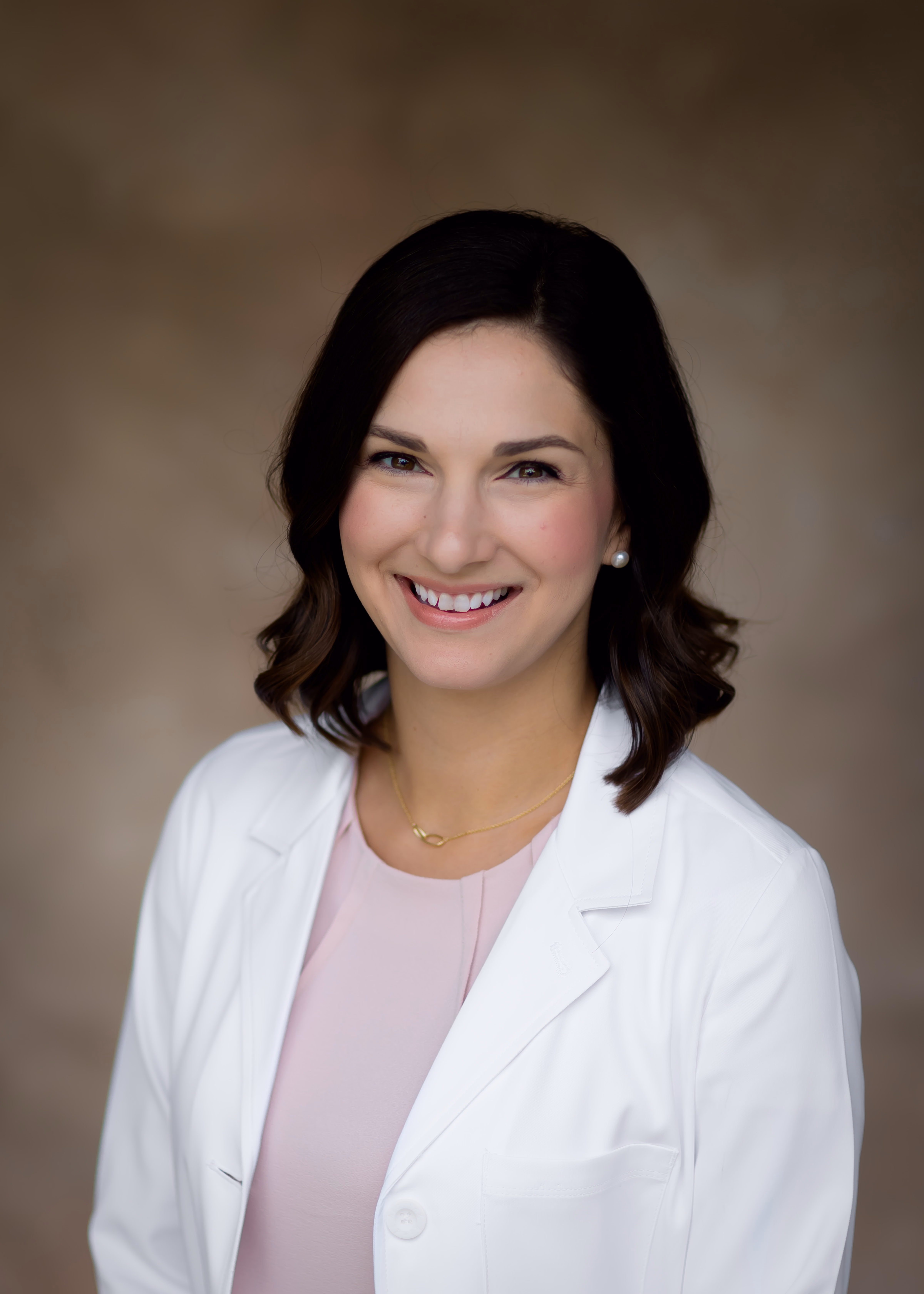 Maïté Adams, FNP-C, in her white coat